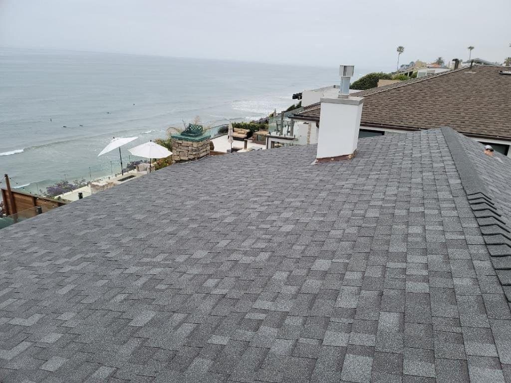 Encinitas Roof Replacement on Neptune Avenue Not much of the roof is visible on the side of the home facing the ocean, but this is the side that takes a brutal beating during the winter storms. It was essential to use an asphalt shingle with a high wind resistance rating.